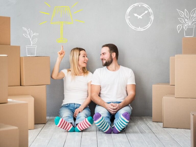 couple surrounded by moving boxes